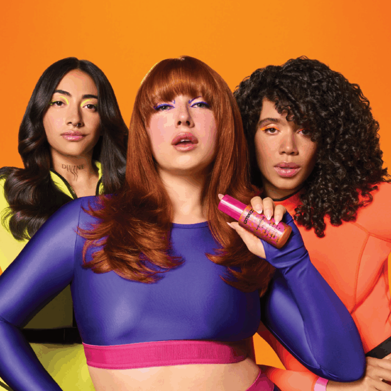Three models showcasing amika professional haircare with smooth, voluminous, and textured hairstyles