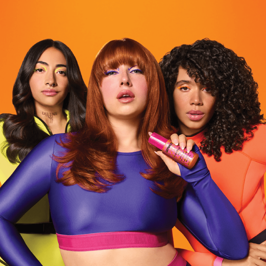 Three models showcasing amika professional haircare with smooth, voluminous, and textured hairstyles